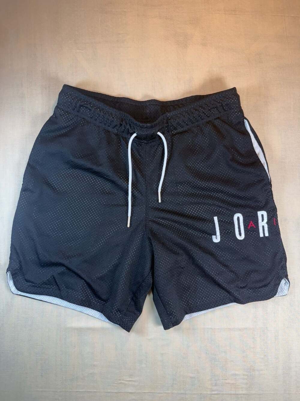 Jordan white/black shorts with black side panels and...
